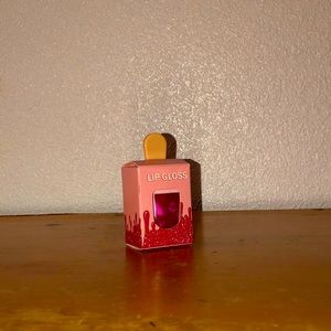 dark pink lip gloss in ice cream bottle